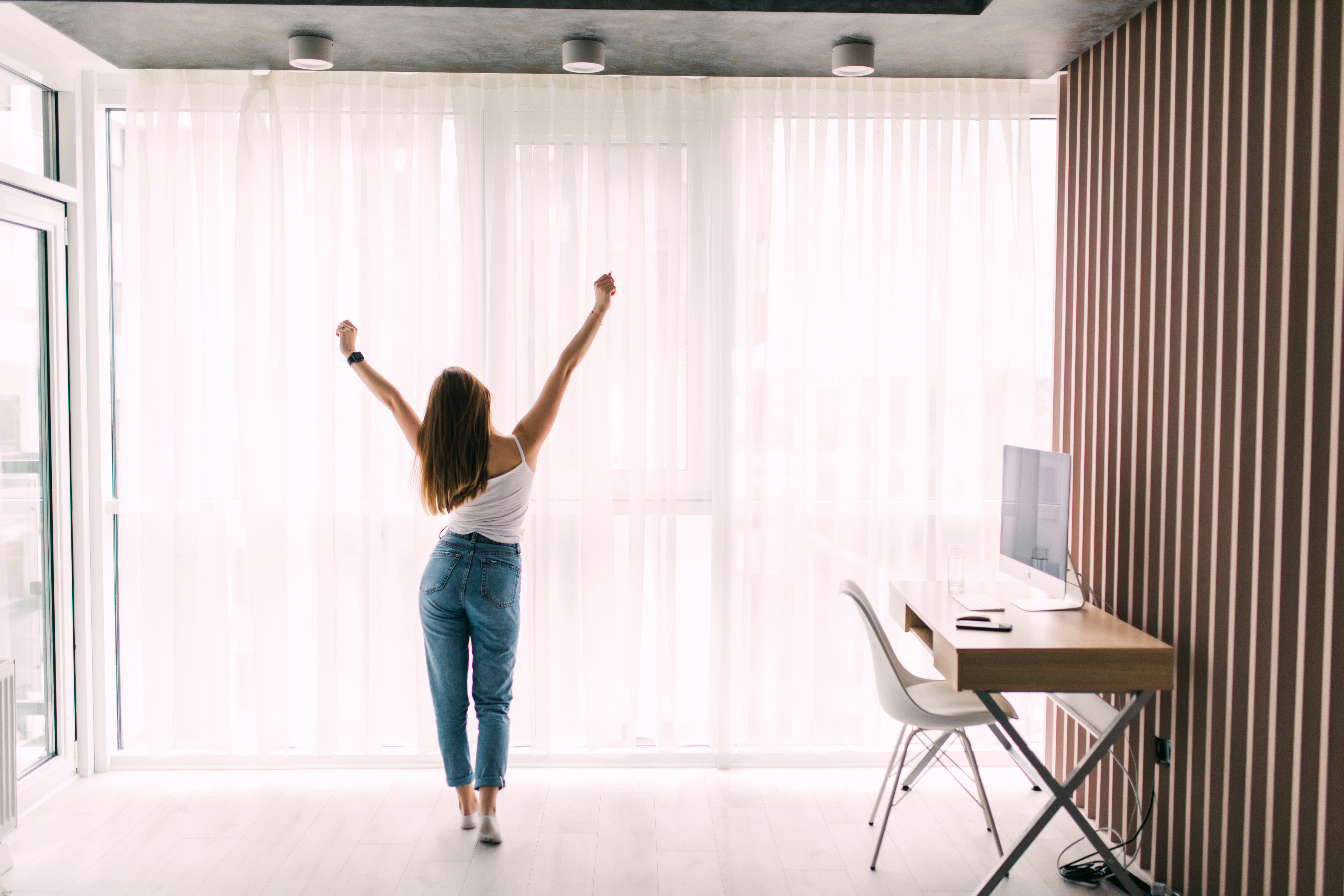 Custom motorized shades and automated window treatments in a luxury apartment